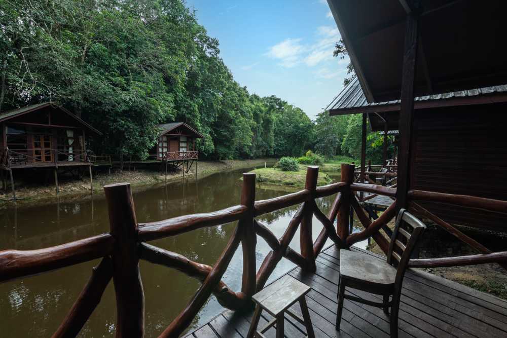 Chalet balcony overlooking the water and neighbouring chalets on stilts